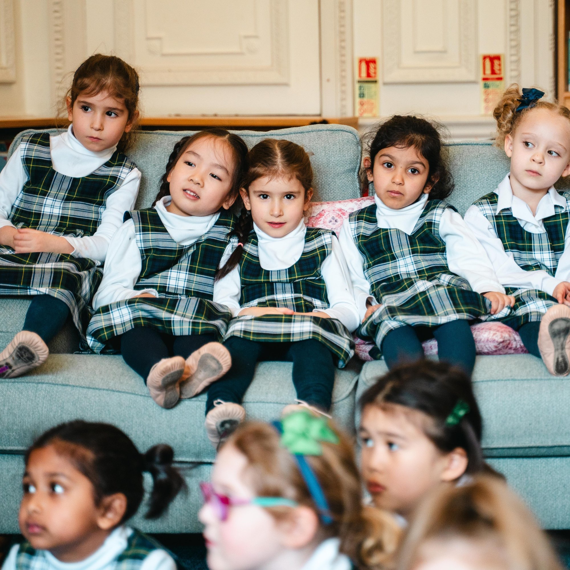 reception girls sat together for reading time